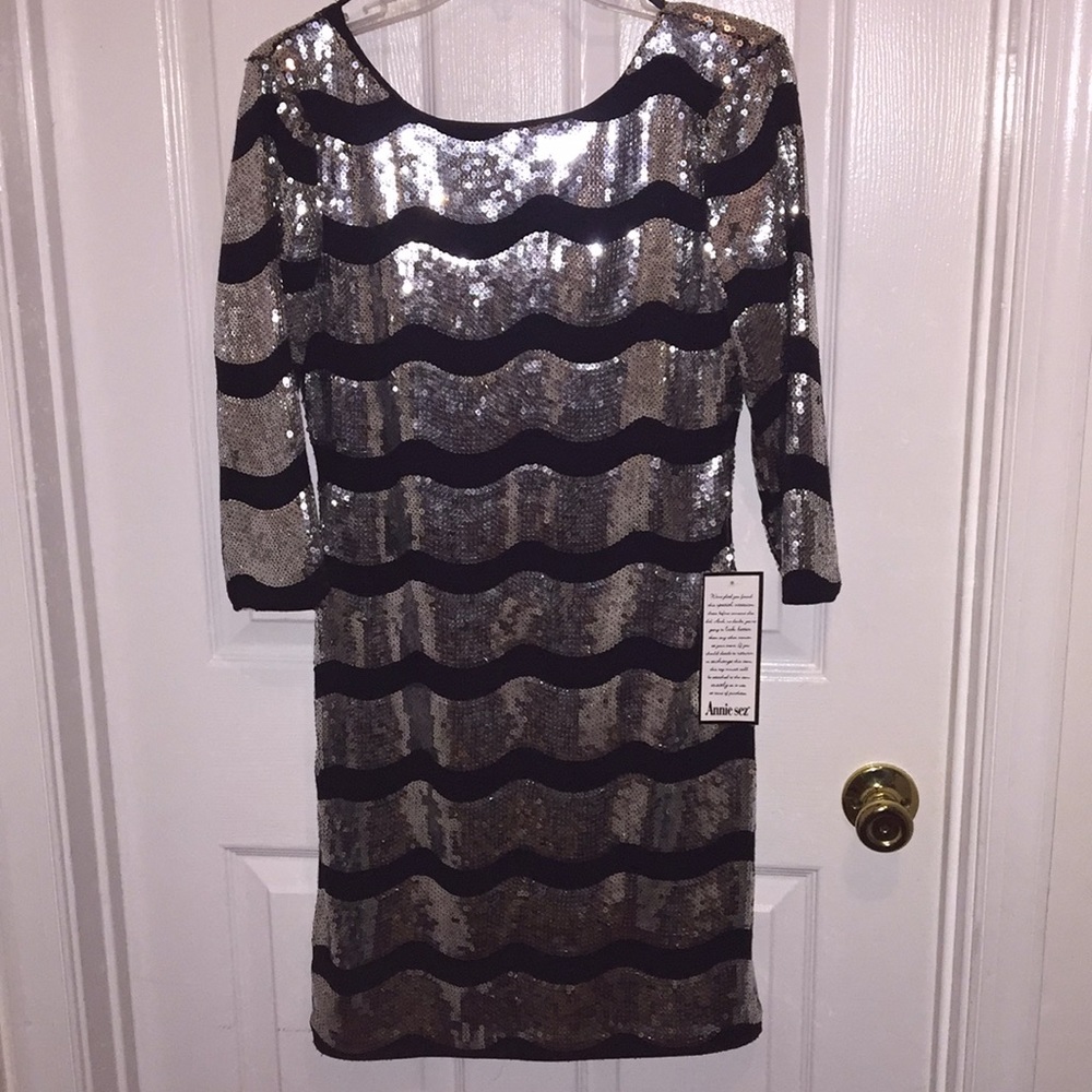Low back, quarter sleeves, sparkly, mini dress.